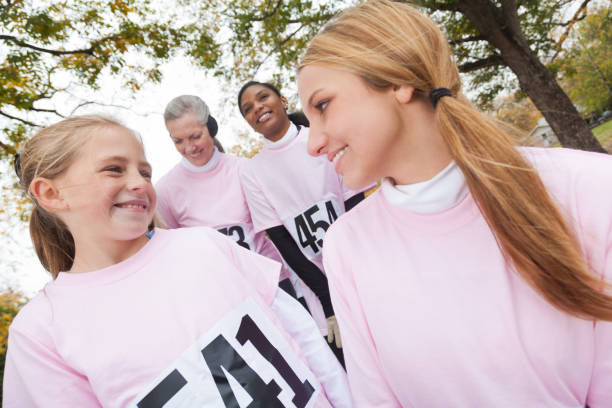 istock Sisters smile while participating in charity event 916727476