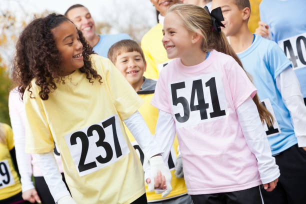 istock Diverse friends walk together during charity event 916727488