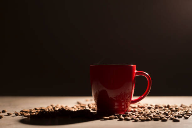 istock Black coffee drink cup  and roasted coffee beans on wooden table 916728326
