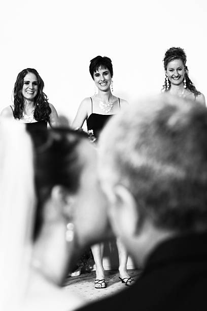 istock Bride and Groom Bokeh with Bridesmaids Smiling 91673524