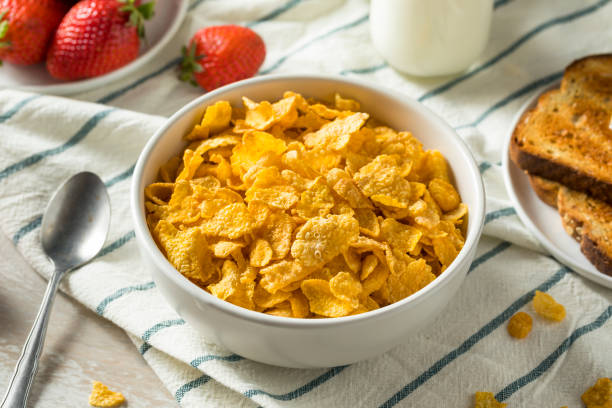 Healthy Corn Flakes with Milk for Breakfast Healthy Corn Flakes with Milk for Breakfast with Fruit cornflakes stock pictures, royalty-free photos & images