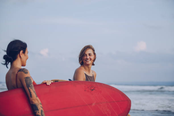 istock Women surfers 916749606