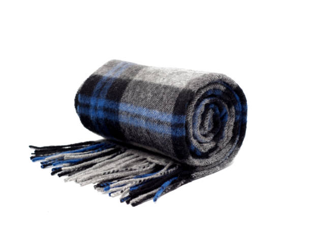 istock Blue plaid scarf over white background. 916749662