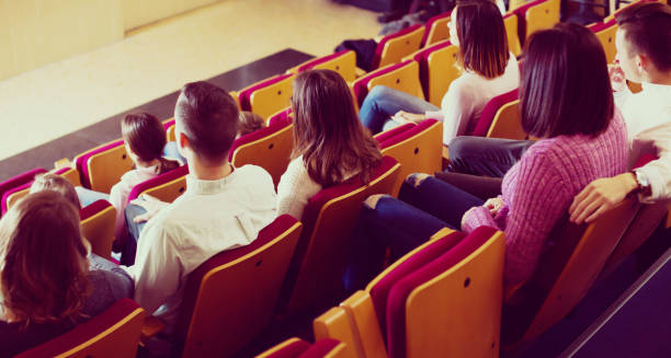 istock Glad audience expecting movie to begin 916758994