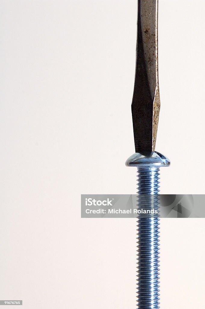 Cacciavite e vite, verticale - Foto stock royalty-free di Affari