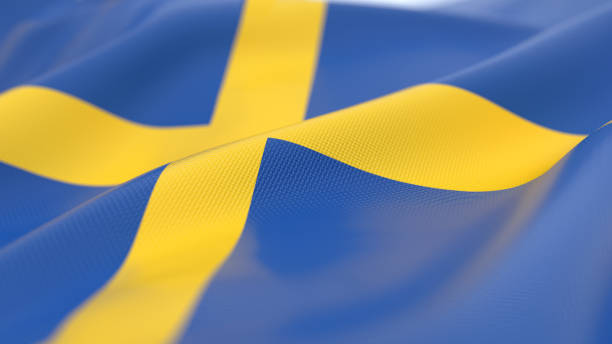 National flag of Sweden flying in the wind against the blue sky