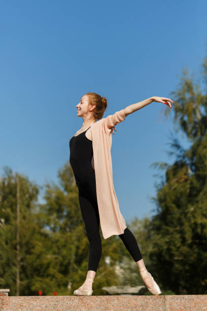 istock Ballerina dancing outdoors 916782620