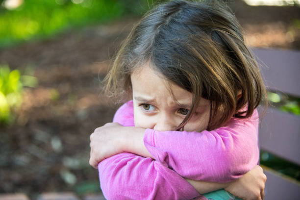 sad little girl looking down