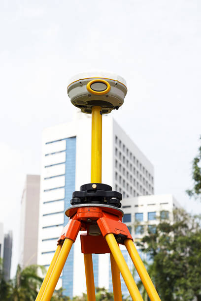 istock GPS survey on field close up and building background, Global Positioning System. 916785912