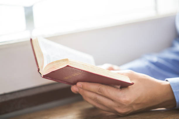 istock A man reading the Holy Bible. 916793602