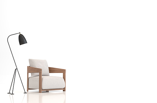 White fabric armchair on white background 3d rendering image.There are clipping path on an armchair and lamp.