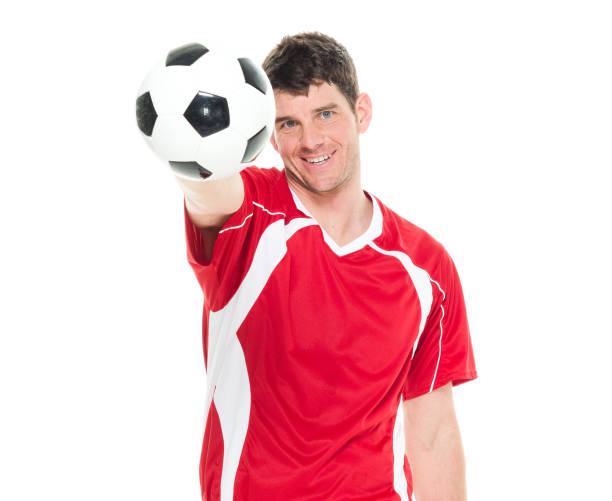 istock Soccer player holding a soccer ball 916799436