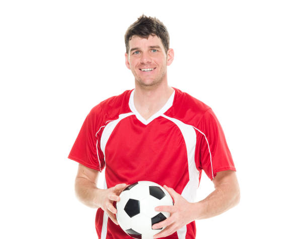 istock Soccer player holding a soccer ball 916799474