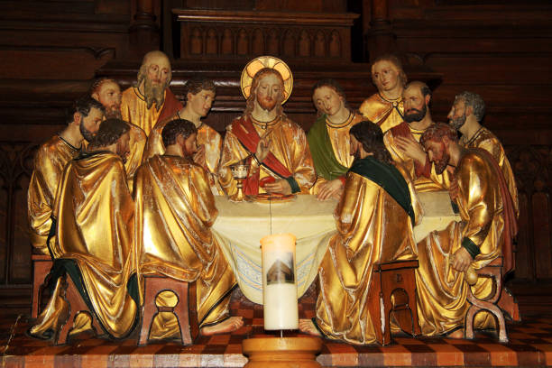 istock Last Supper with Jesus at the table and apostles 916799510