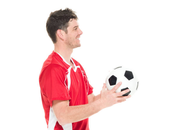 istock Soccer player holding a soccer ball 916799574