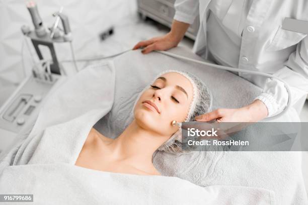 Woman During The Facial Treatment Procedure Stock Photo - Download Image Now - Healthcare And Medicine, Make-Up, Beauty