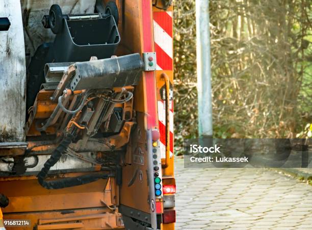 Garbage Man Collecting The Bins Stock Photo - Download Image Now - Adult, City, Clothing