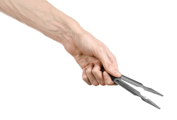 istock Hookah topic: Bartender holding a hookah coal tongs isolated on a white background 916812314