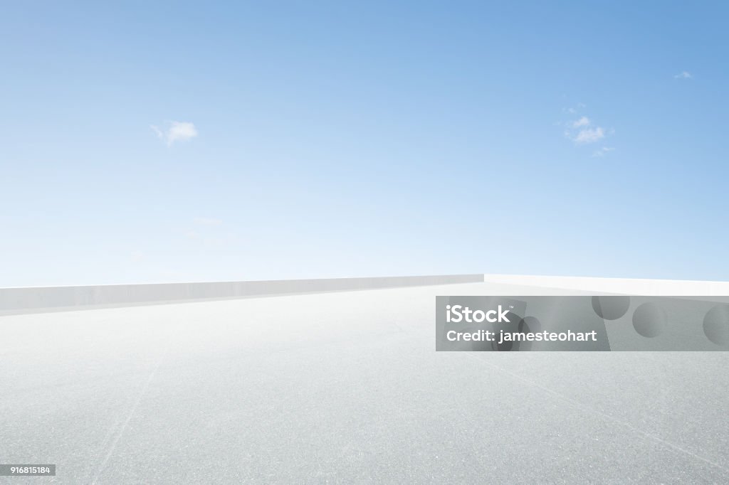 Empty space top floor Empty open space top floor with clear blue sky . Rooftop Stock Photo