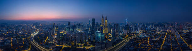 Panorama cityscape view Panorama aerial view in the middle of Kuala Lumpur cityscape skyline .Night scene before sunrise , Malaysia . kuala lumpur photos stock pictures, royalty-free photos & images
