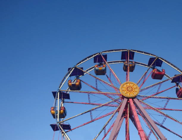 istock Wheel in amusement park 916817600