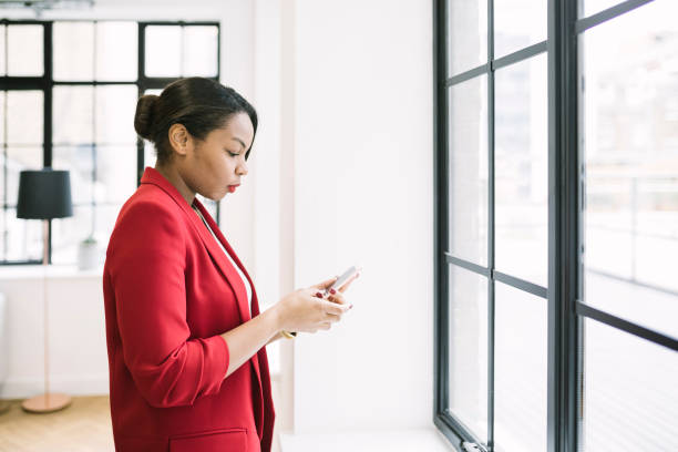 istock Businesswoman Using Smartphone 916818686
