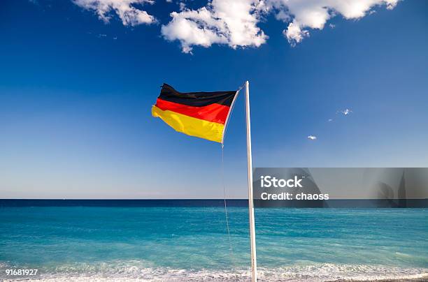 Bandera Alemana Sobre Cielo Azul De Fondo Foto de stock y más banco de imágenes de Alemania - Alemania, Azul, Bandera