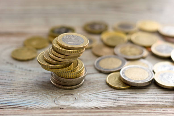 istock Coins stacked on each other in different positions 916821872