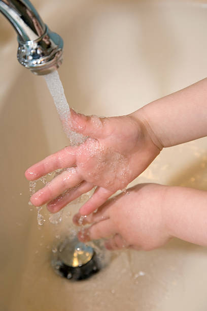 istock Toddler Washing Hands Closeup 91682290