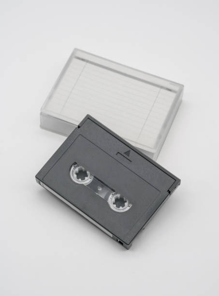 istock Digital audio tape and white packaging plastic box isolated on white background 916824404