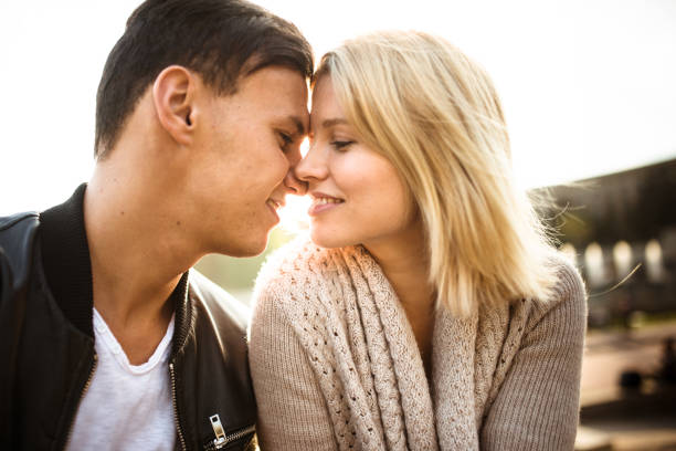 istock couple flirting at dusk 916825652
