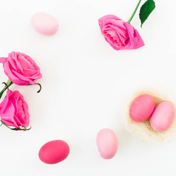 istock Pink Easter egg in nest and pink roses on white background. Top view, Fat lay. Easter holiday concept. 916830026