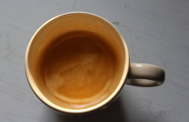 istock Cup of black coffee on wooden background 916836208