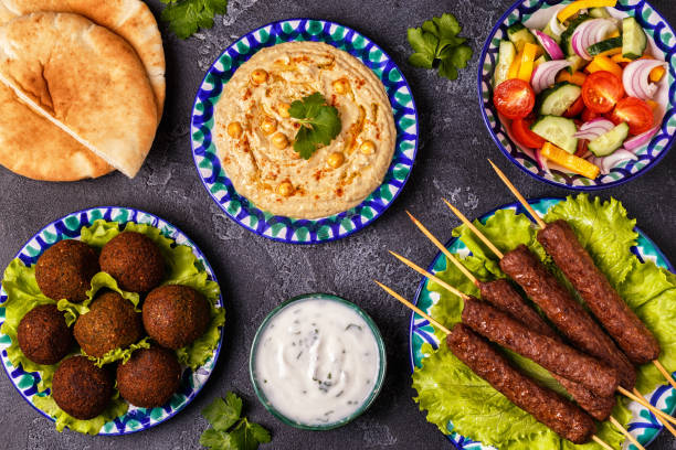 istock Classic kebabs, falafel and hummus on the plates. 916836282