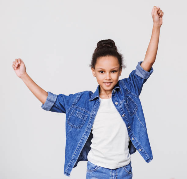istock Happy little girl cheering 916836600