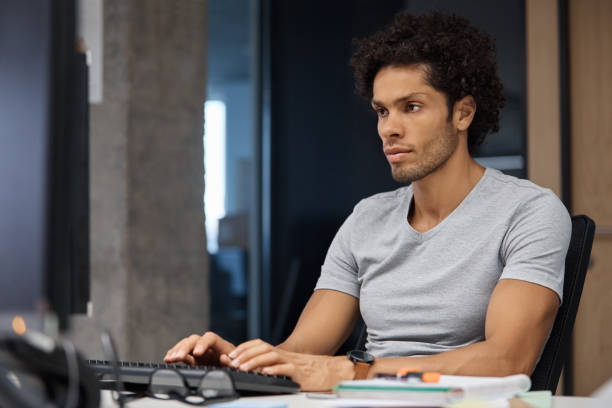 istock Confident businessman working at desk in office