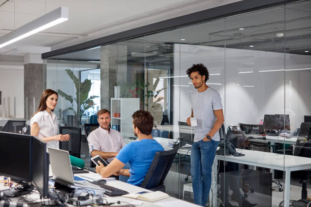 istock Confident professionals discussing in meeting 916837296