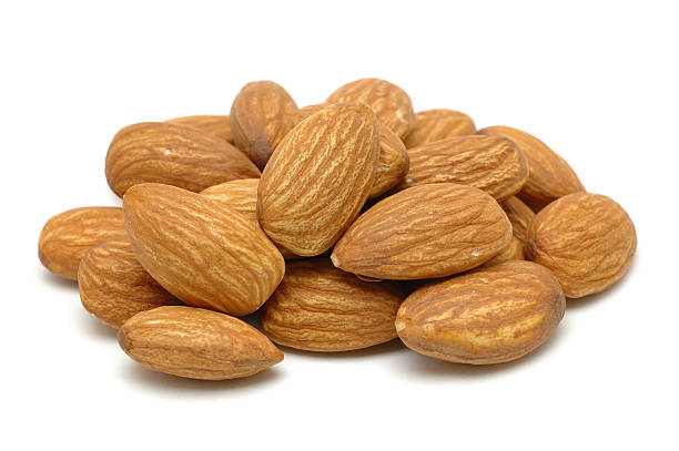 istock Pile of ripe brown almonds on a white background 91684000