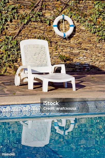 Buoy And White Deckchair Near The Swimming Pool Stock Photo - Download Image Now - Armchair, Blue, Buoy