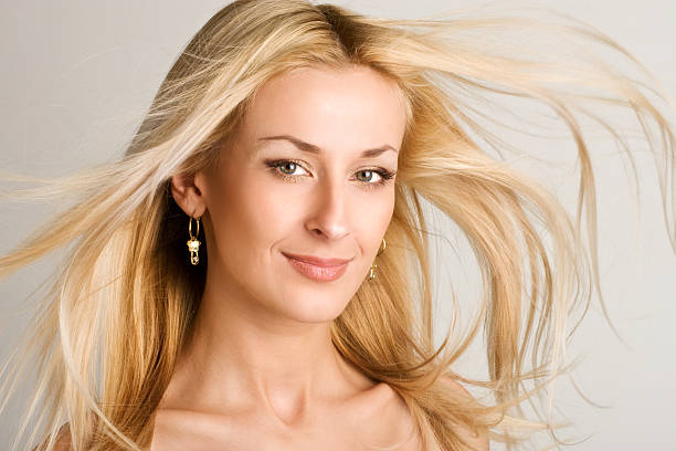 beautiful blond with great fly-away hair stock photo