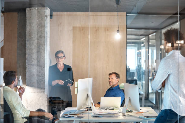 istock Business people discussing at conference table 916844530