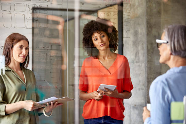 istock Businesswomen having discussion in office 916844732
