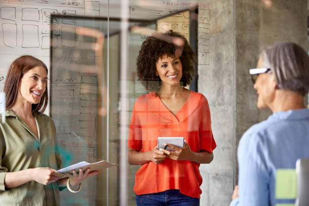 istock Businesswomen having discussion in new office 916844752