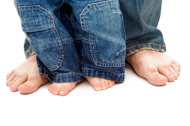 istock father's and son's feet 91684525