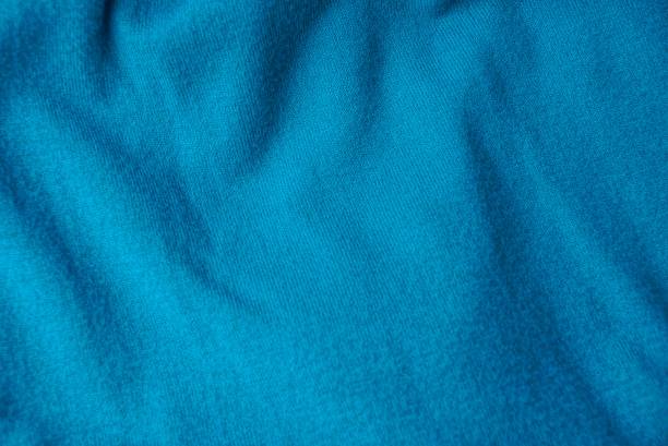 istock turquoise woolen texture from a fragment of crumpled clothes 916845814