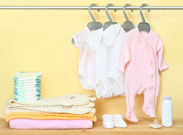 Closet with cute clothes and accessories for newborn stock photo