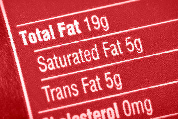 High In Fat Nutritional label with focus on fats. saturated fat stock pictures, royalty-free photos & images