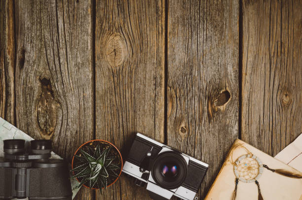 istock Travel accessories top view on wooden background with copy space 916851714