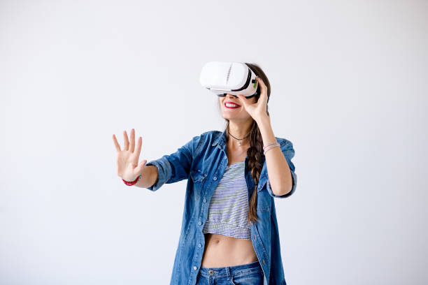 istock Laughing girl with VR glasses 916855022