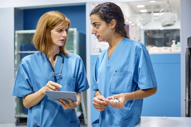istock Vet doctors discussing over tablet pc in clinic 916855650